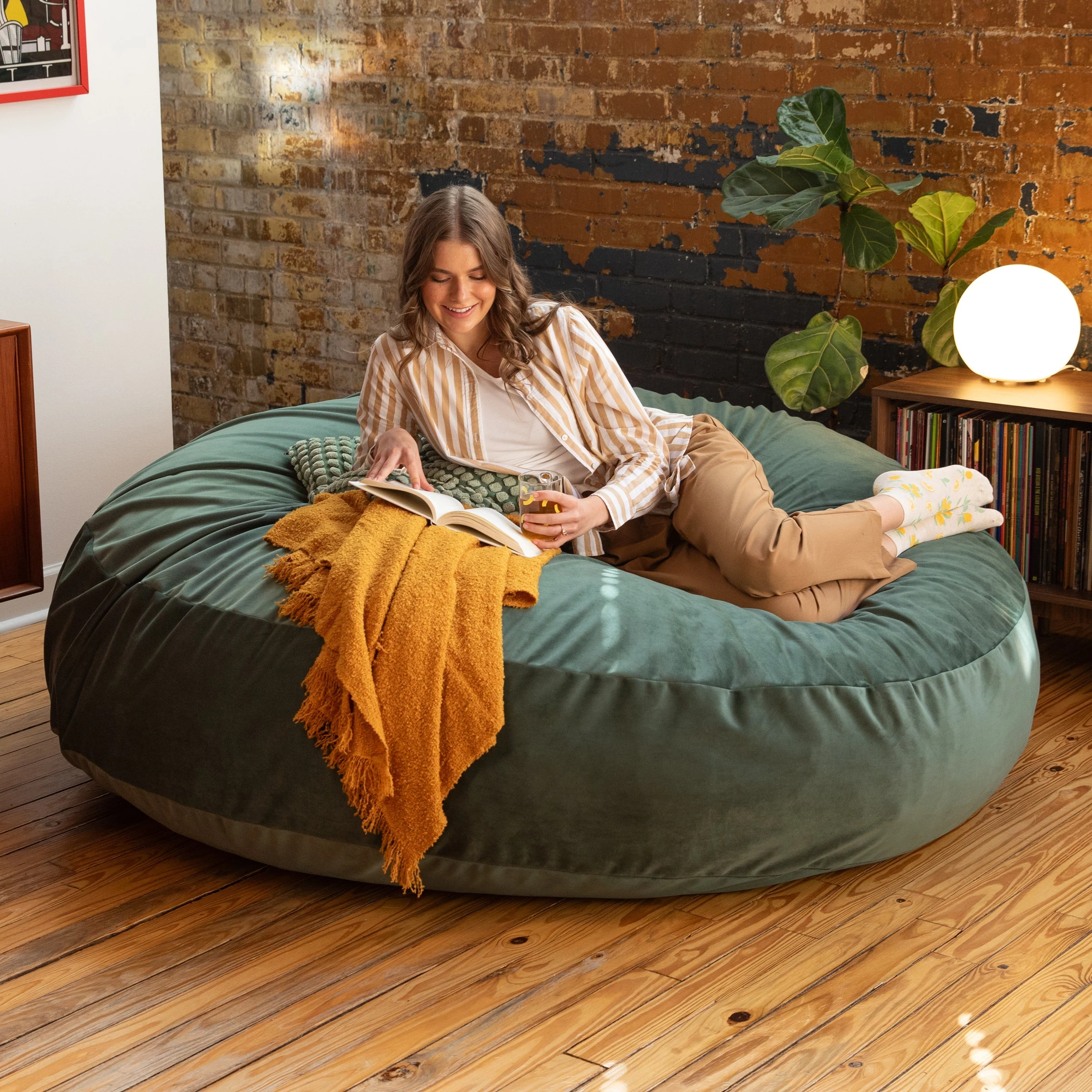 Green velvet Jaxx Cocoon 6 in a living room
